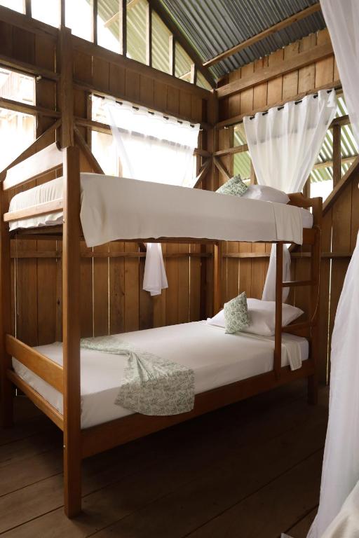 Postel nebo postele na pokoji v ubytování La Ceiba, Amazonas