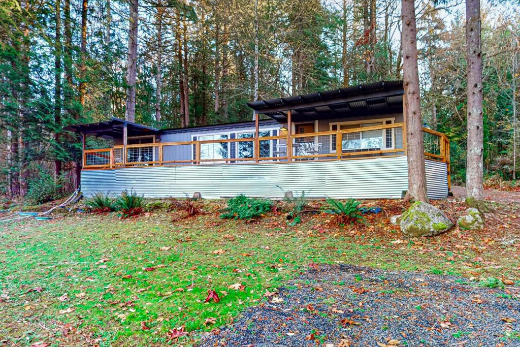 a house in the middle of a forest at WatersView Tree House in Shelton