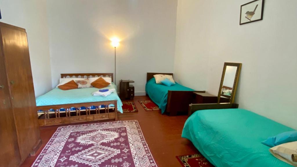 Postel nebo postele na pokoji v ubytování Hotel Dolegant