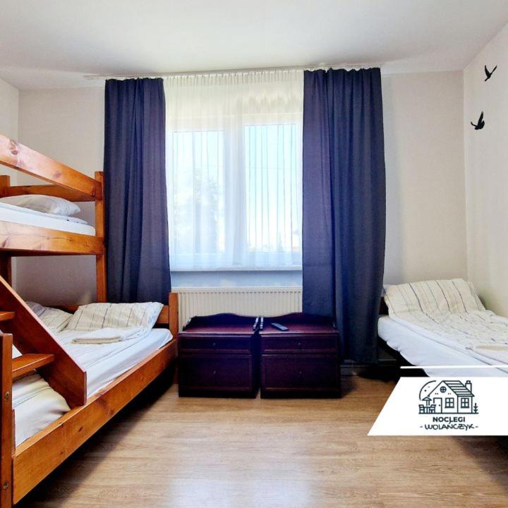 Posteľ alebo postele v izbe v ubytovaní Apartament - Jurczak