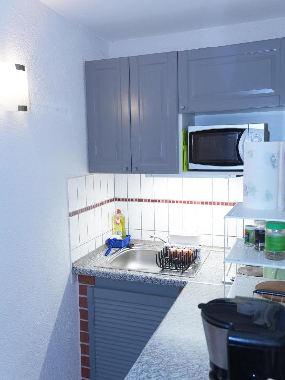 Kuchyň nebo kuchyňský kout v ubytování Appartement Am Goldberg
