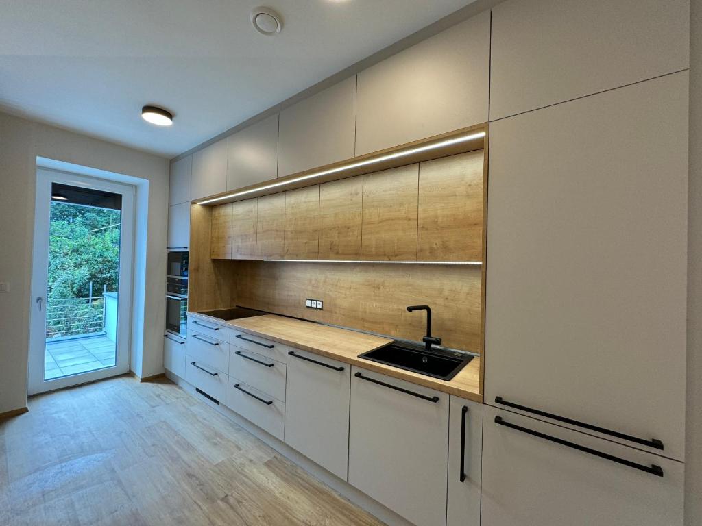 Kuchyň nebo kuchyňský kout v ubytování Fresh Apartments