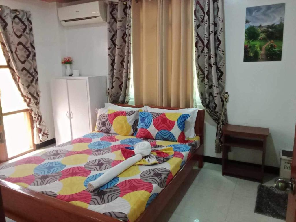 Postel nebo postele na pokoji v ubytování Buena's Haven Travelodge