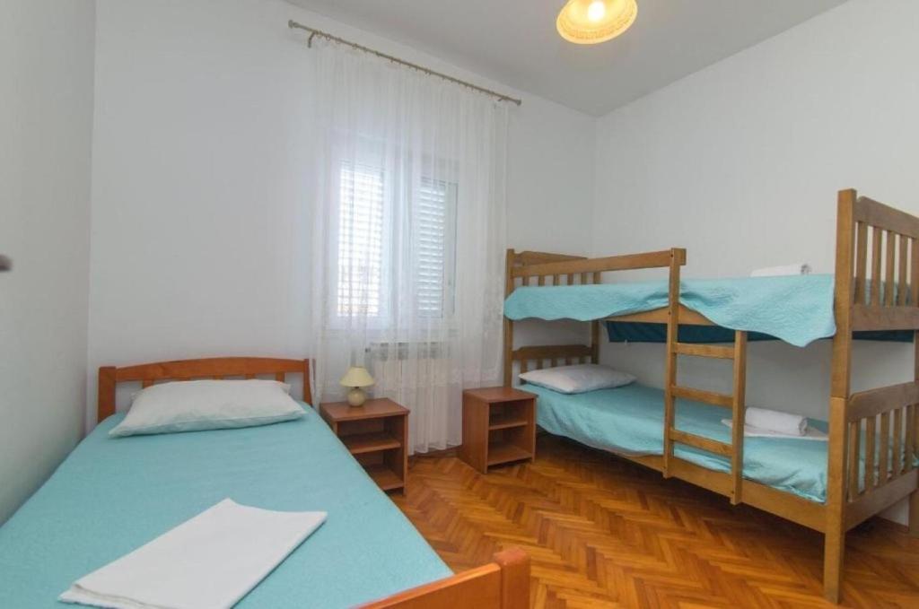 Posteľ alebo postele v izbe v ubytovaní Apartment Kreso
