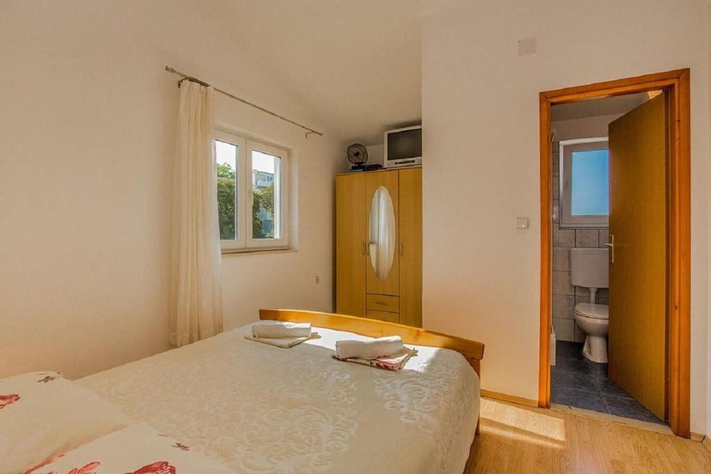Posteľ alebo postele v izbe v ubytovaní Apartment Kreso