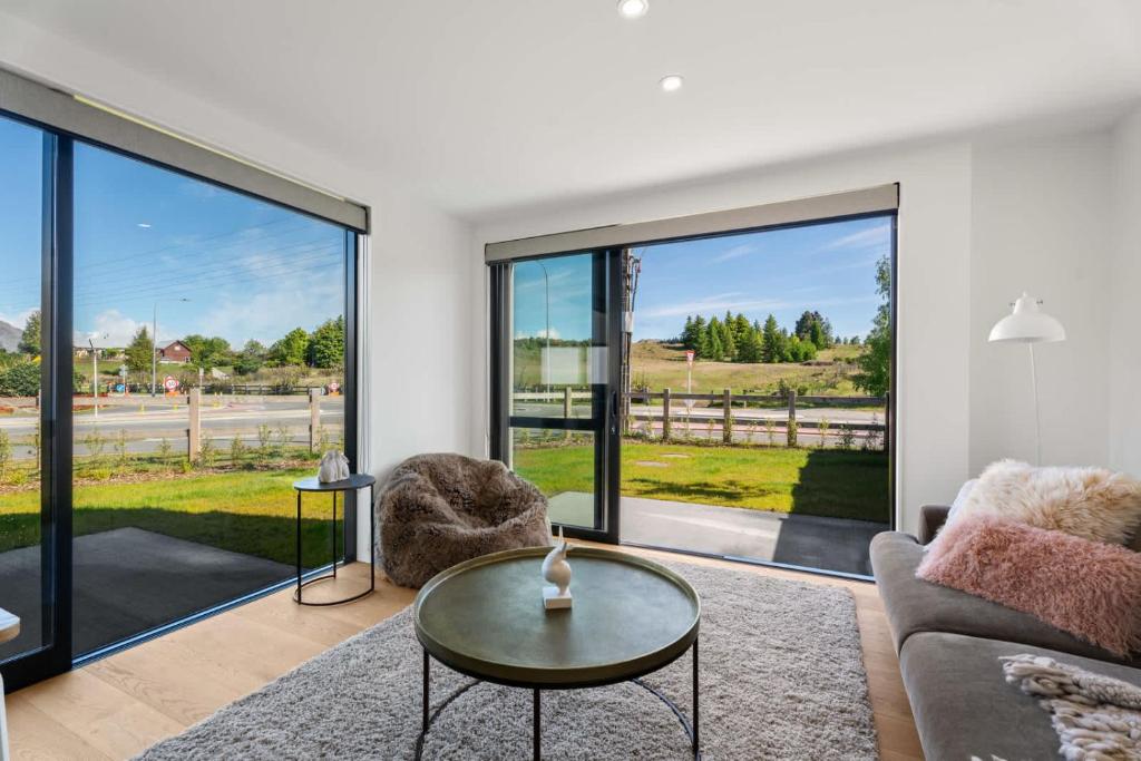 a living room with a couch and a table at Best Day Ever in Wanaka