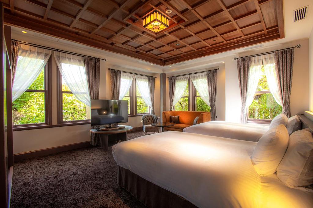 Postel nebo postele na pokoji v ubytování Hotel Utano Kyoto Besho