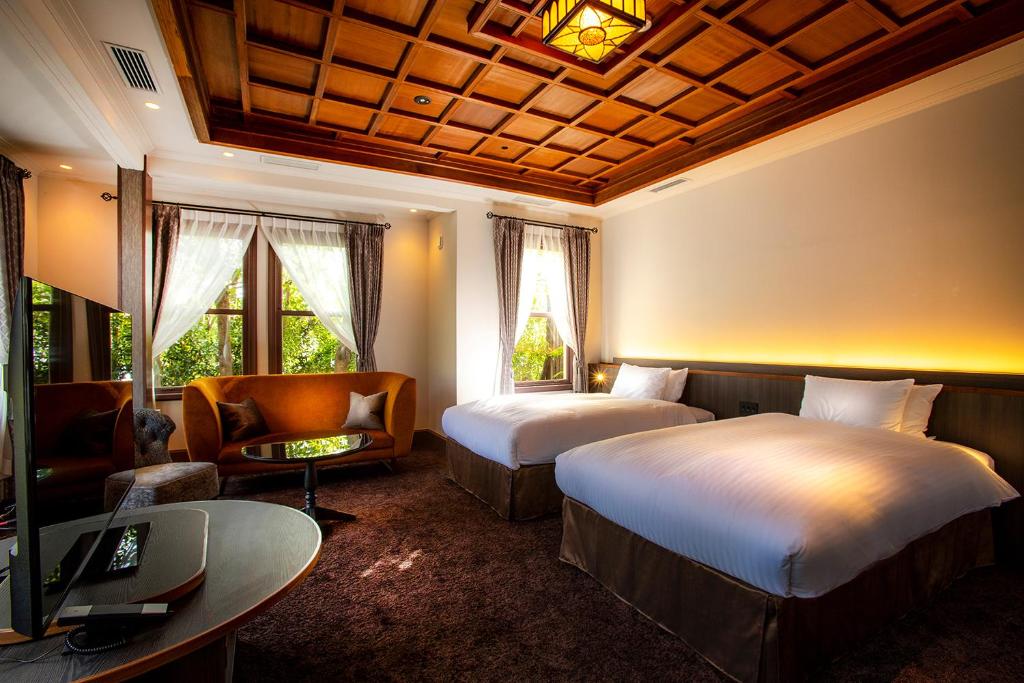 Postel nebo postele na pokoji v ubytování Hotel Utano Kyoto Besho