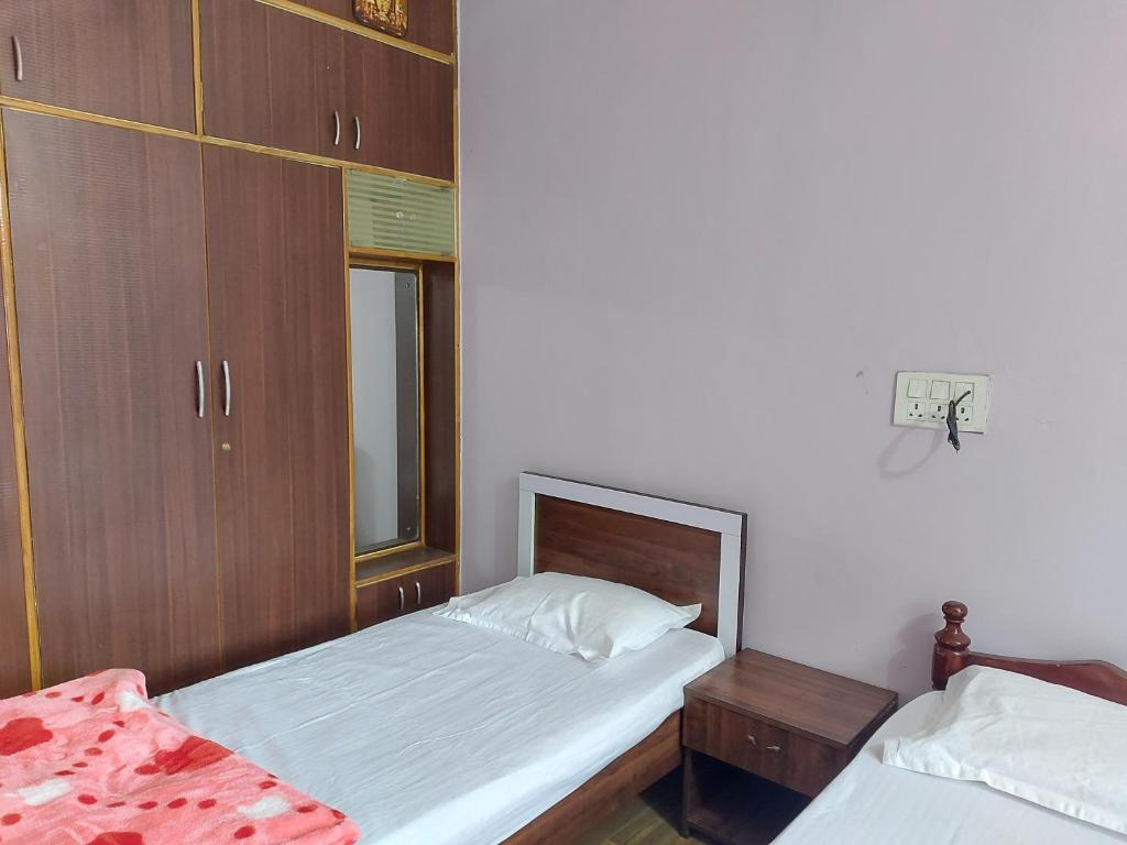 Postel nebo postele na pokoji v ubytování Prestige Nature Homestay Chikmagalur