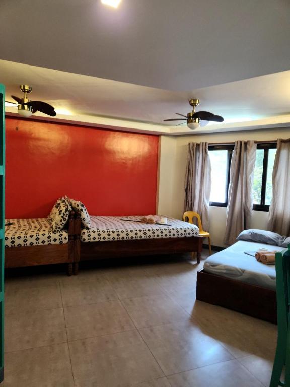 Postel nebo postele na pokoji v ubytování Inngo Tourist Inn