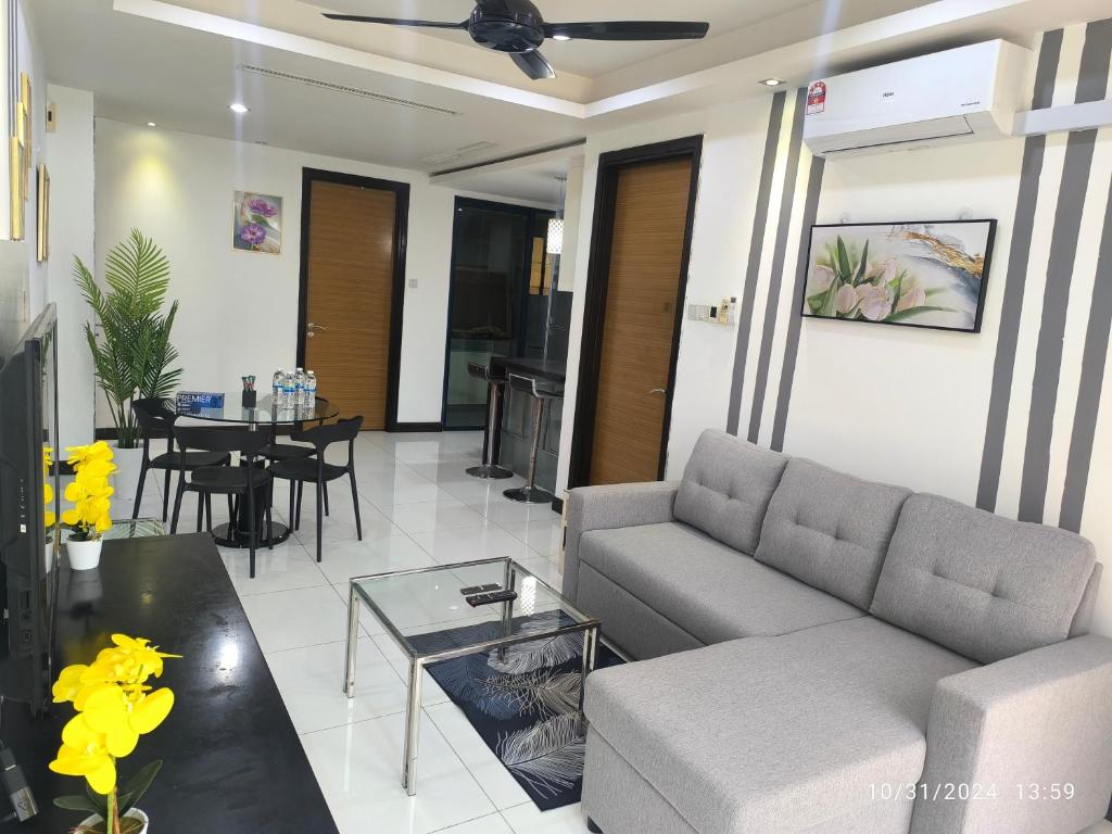 a living room with a couch and a table at 018-6 Sweet Home-Casa Residency 2R 2B in Kuala Lumpur
