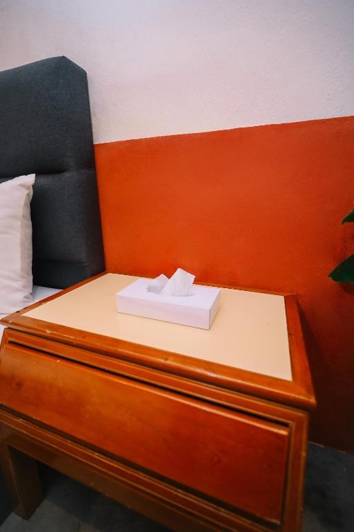 Letto o letti in una camera di Swing & Pillows - 75 Chulia St, Georgetown Penang