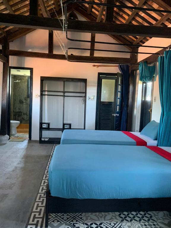 Postel nebo postele na pokoji v ubytování Calm House 3 Boutique hotel Hoi An