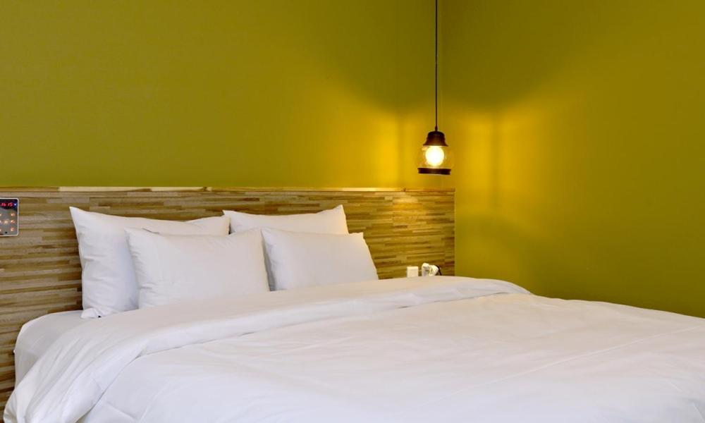 Postel nebo postele na pokoji v ubytování Hotel Yeogieutte Dongdaegu