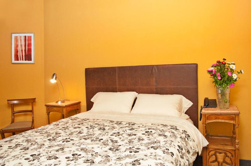 Postel nebo postele na pokoji v ubytování La Morada Posada Boutique