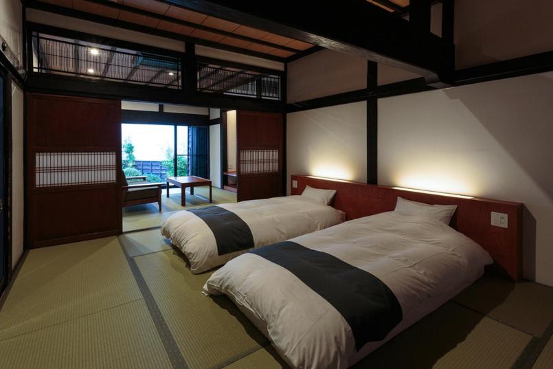 a bedroom with two beds in a room at Ryugon in Minami Uonuma