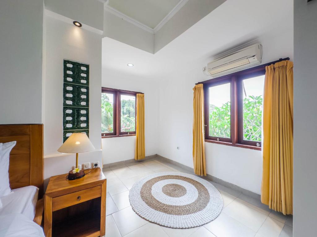 Postel nebo postele na pokoji v ubytování Uma Dana Ubud
