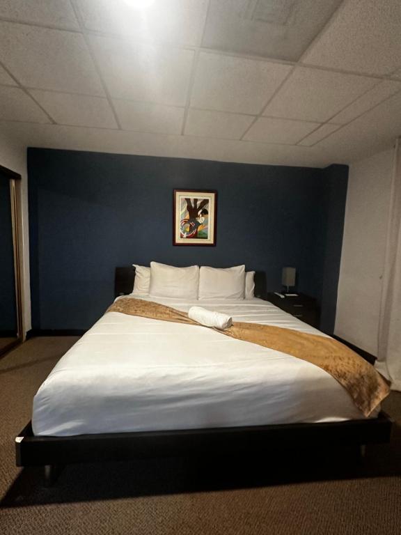 Postel nebo postele na pokoji v ubytování SJ SUITES HOTEL