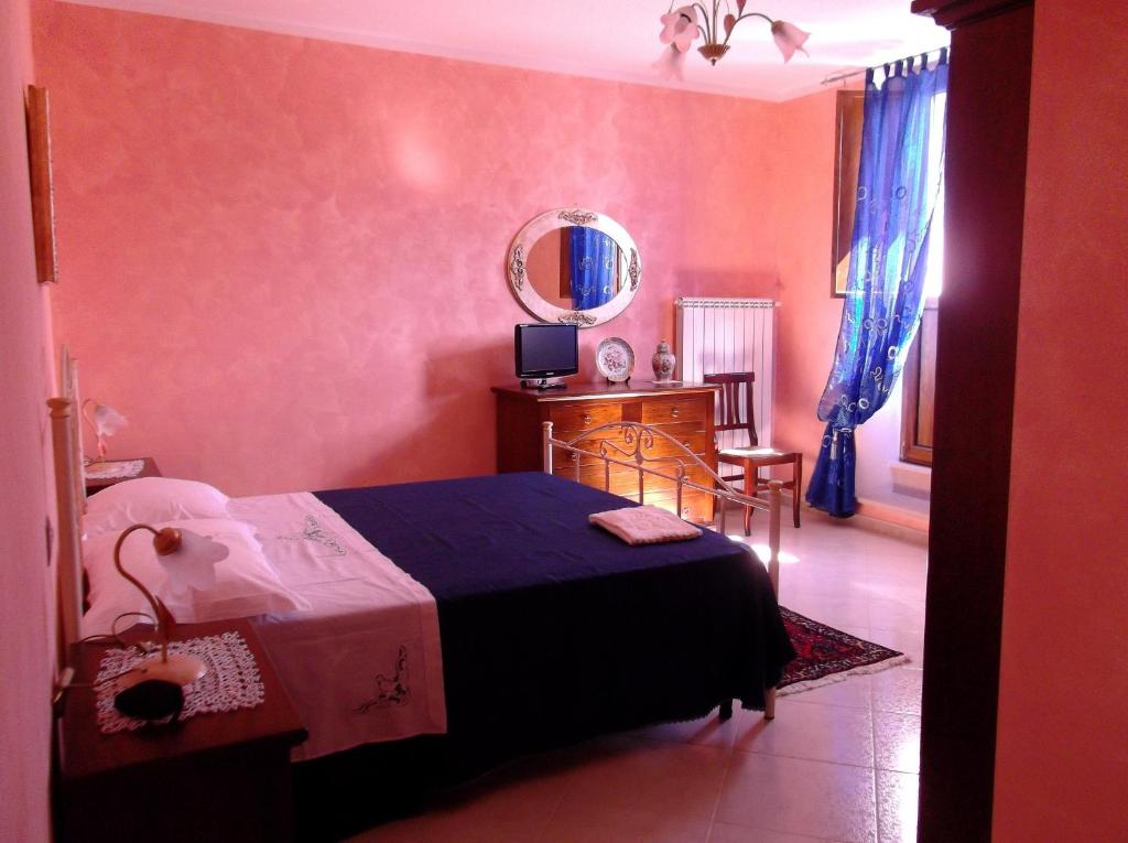 Postel nebo postele na pokoji v ubytování Dolcedorme Bed And Breakfast