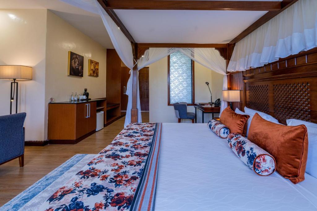 Postel nebo postele na pokoji v ubytování Ciala Resort Hotels In Kisumu