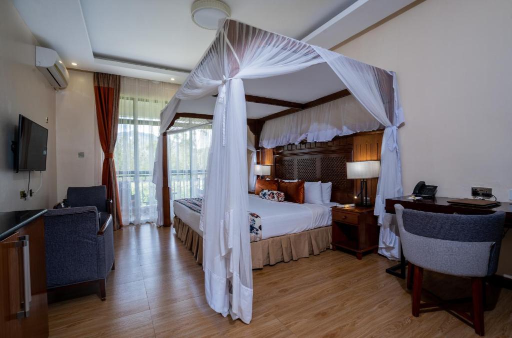 Postel nebo postele na pokoji v ubytování Ciala Resort Hotels In Kisumu