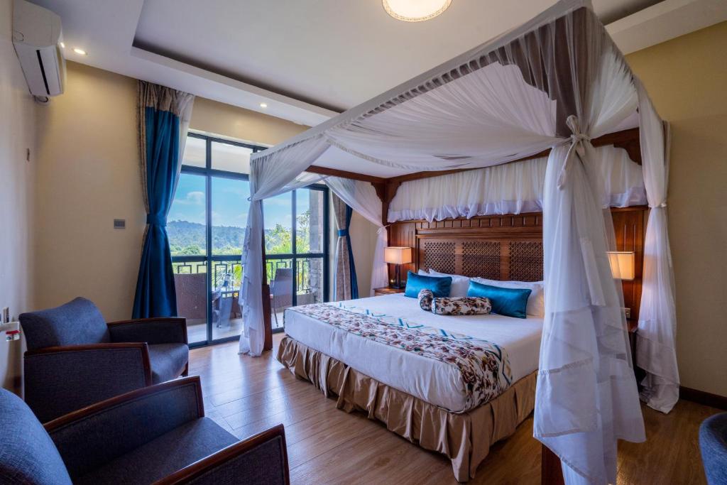 Postel nebo postele na pokoji v ubytování Ciala Resort Hotels In Kisumu