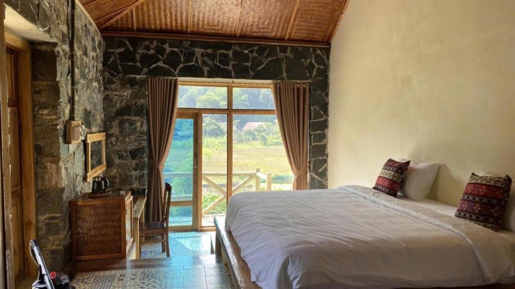 Giường trong phòng chung tại Ha Giang Ecolodge