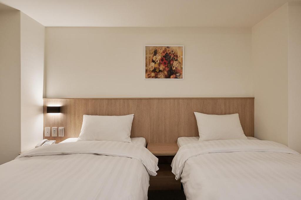 Voodi või voodid majutusasutuse Nei Jiang Hotel toas