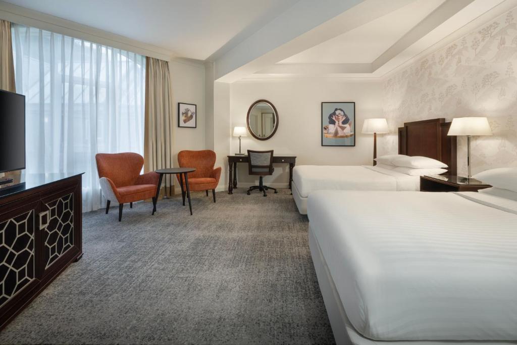 Ein Bett oder Betten in einem Zimmer der Unterkunft Delta Hotels by Marriott Worsley Park Country Club