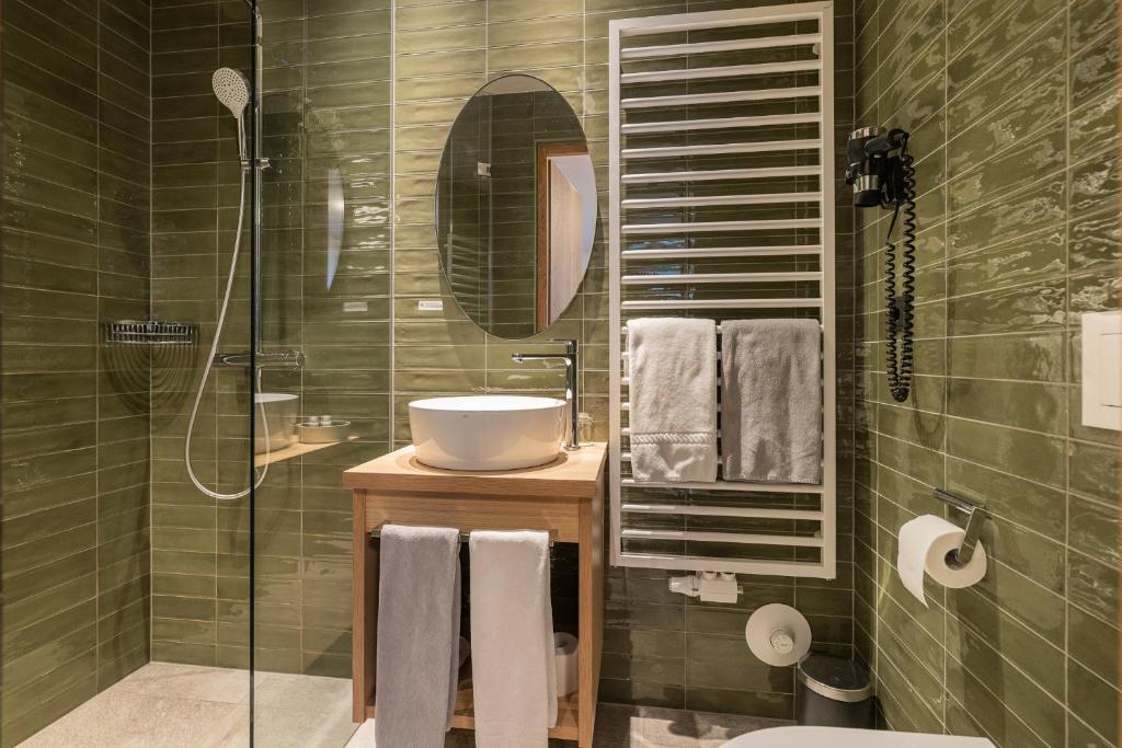 Koupelna v ubytování Gasthof Albergo Dolomiten