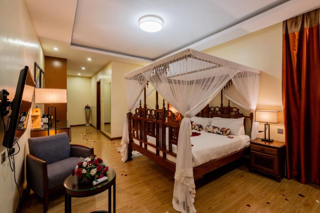 Postel nebo postele na pokoji v ubytování Ciala Resort Hotels In Kisumu