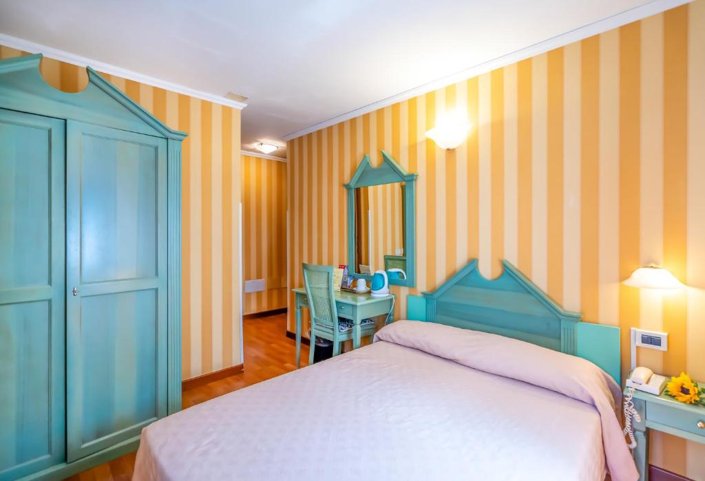 Voodi või voodid majutusasutuse Hotel Tintoretto toas