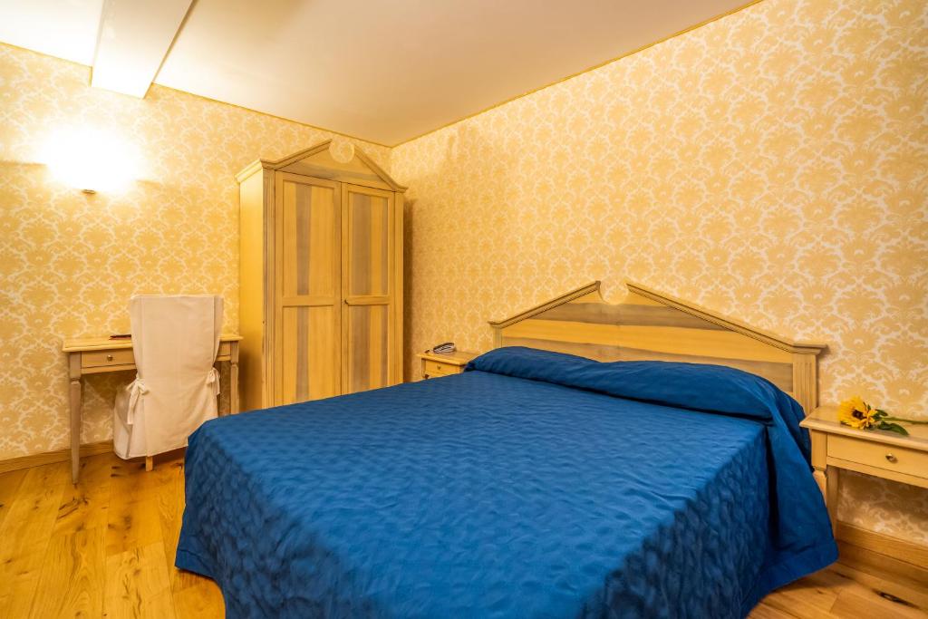Voodi või voodid majutusasutuse Hotel Tintoretto toas