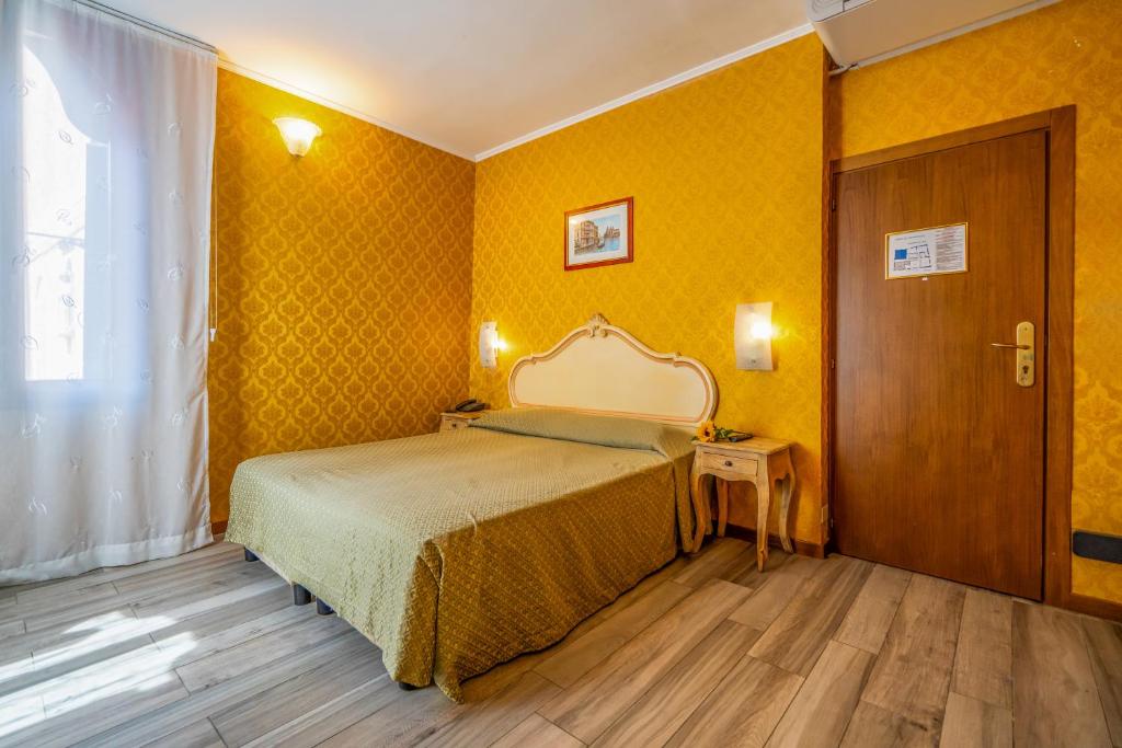 Voodi või voodid majutusasutuse Hotel Tintoretto toas