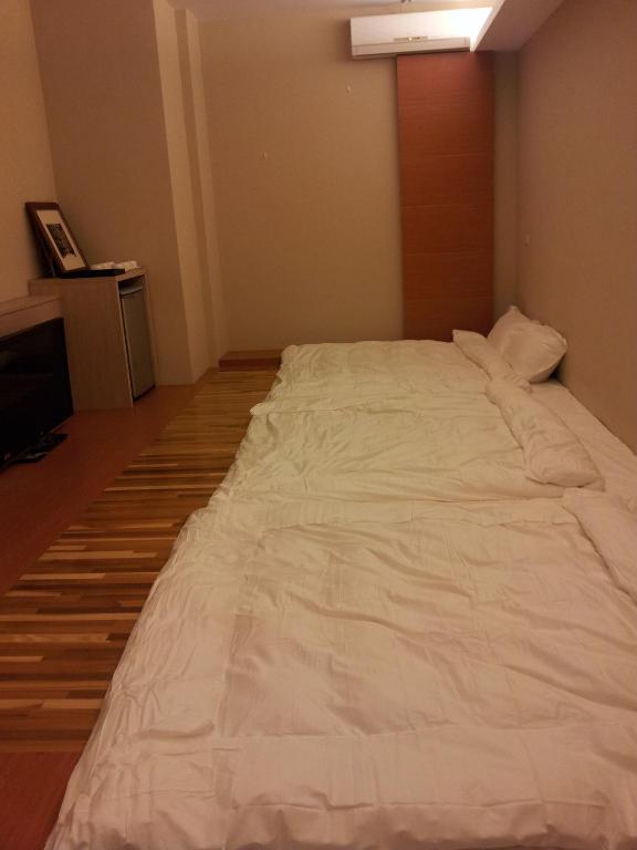 Postel nebo postele na pokoji v ubytování Haliluya Homestay
