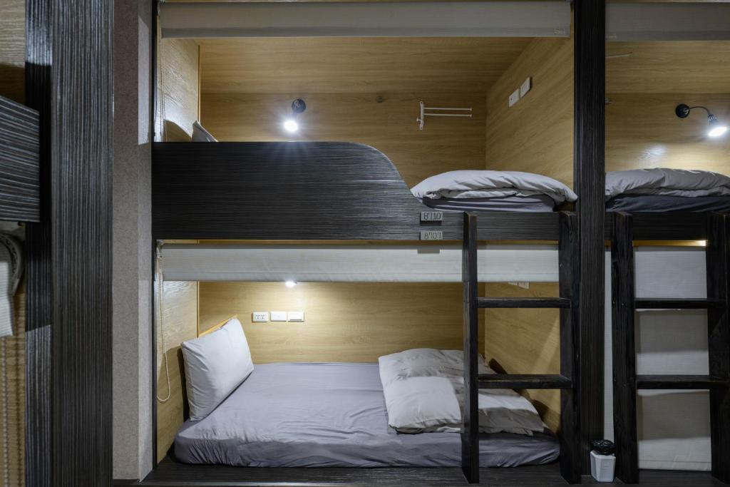 Postel nebo postele na pokoji v ubytování WORK INN TPE