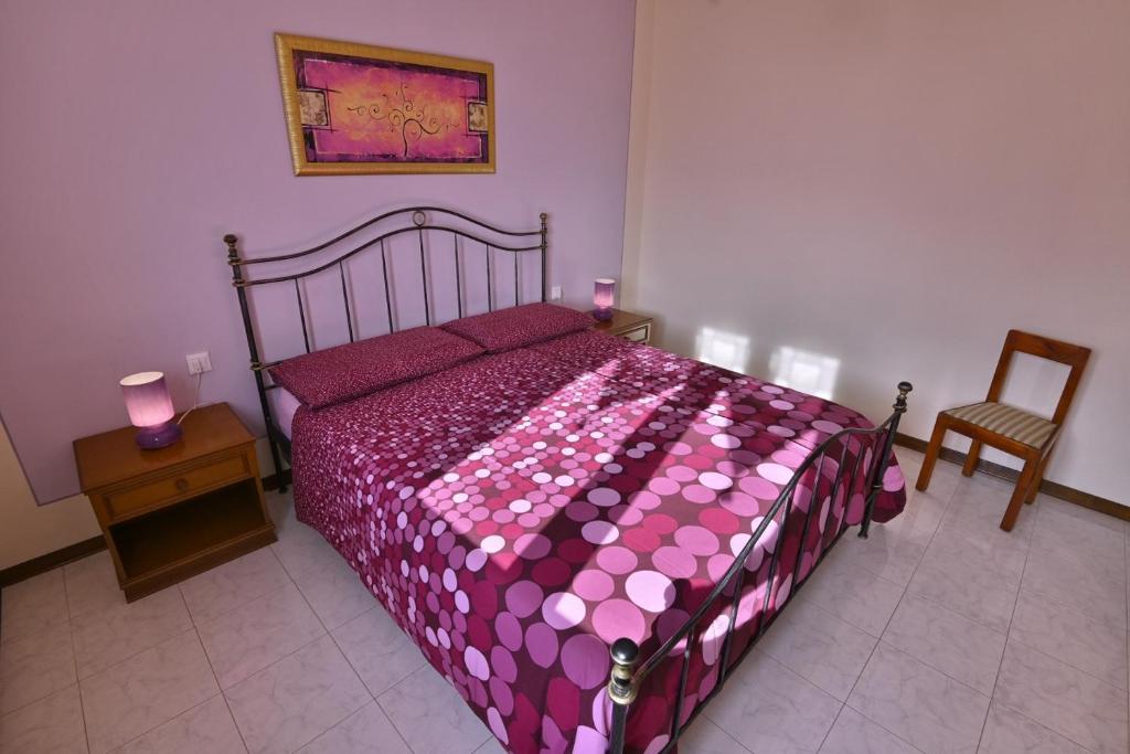 Łóżko lub łóżka w pokoju w obiekcie Villa Margherita - Theater Home