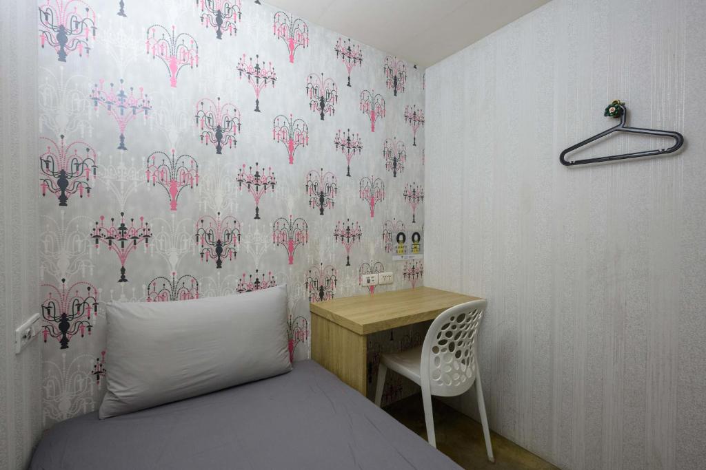 Postel nebo postele na pokoji v ubytování WORK INN TPE
