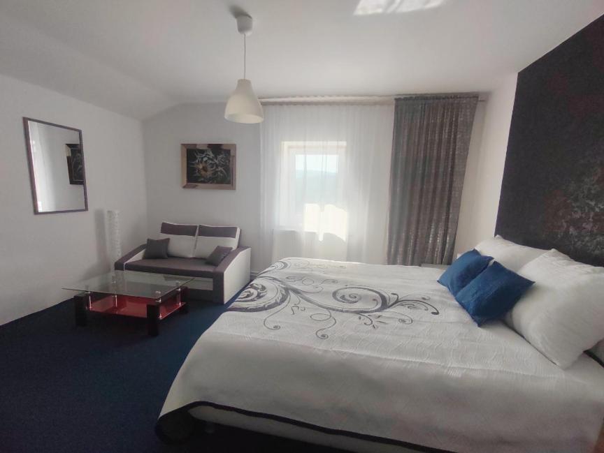 Posteľ alebo postele v izbe v ubytovaní Dvoupokojový apartmán Penzion Hrádek