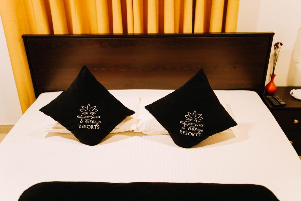 Postel nebo postele na pokoji v ubytování Abhaya Resorts