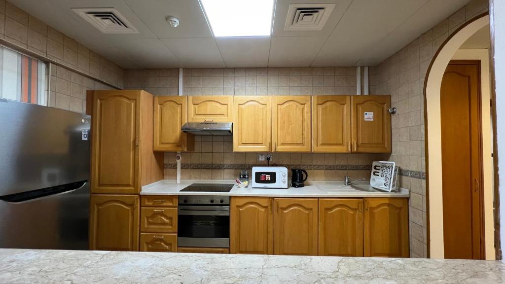 Kuchyň nebo kuchyňský kout v ubytování Uptown Hotel Apartments Abu Dhabi by Gewan
