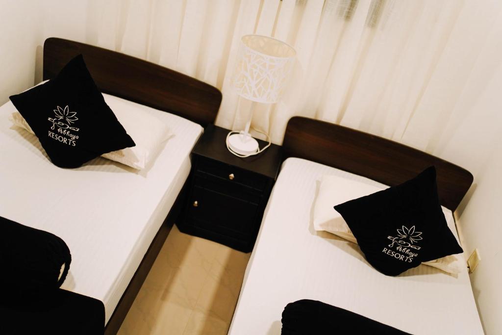Postel nebo postele na pokoji v ubytování Abhaya Resorts