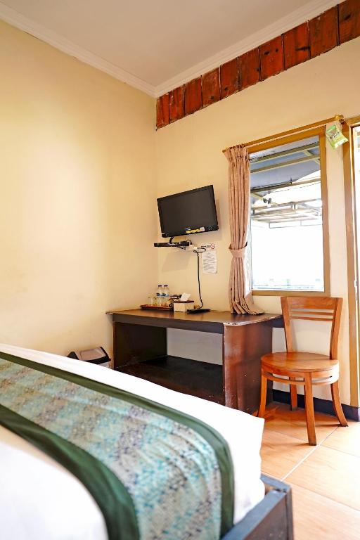 TV a/nebo společenská místnost v ubytování Saung Balibu Hotel