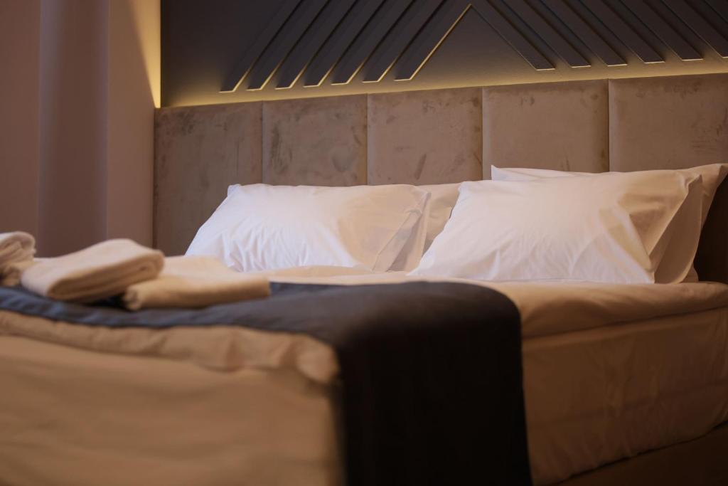 Voodi või voodid majutusasutuse Nest Suites toas