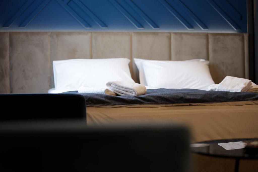 Voodi või voodid majutusasutuse Nest Suites toas