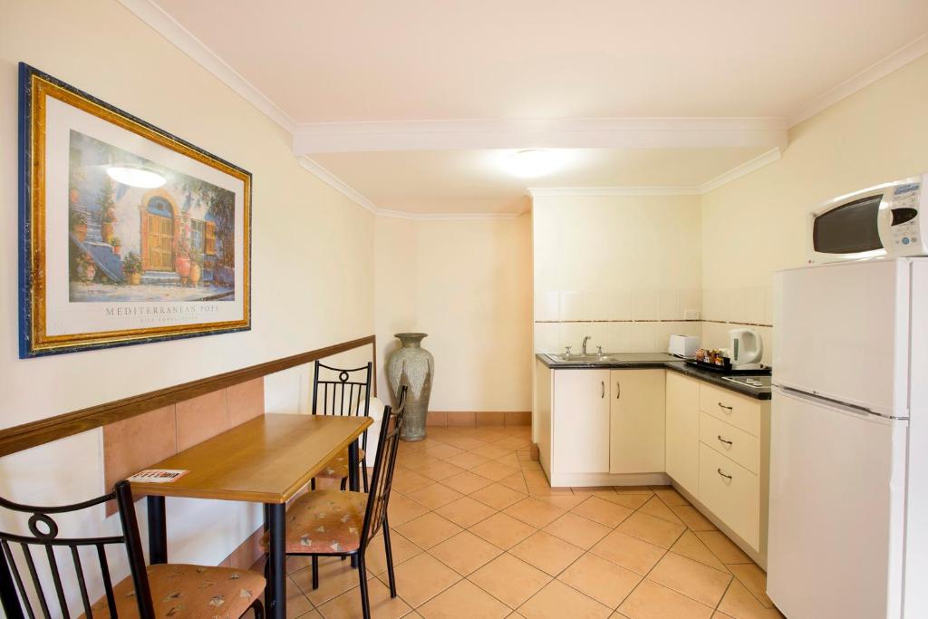 Kuchyň nebo kuchyňský kout v ubytování Glenmore Tavern