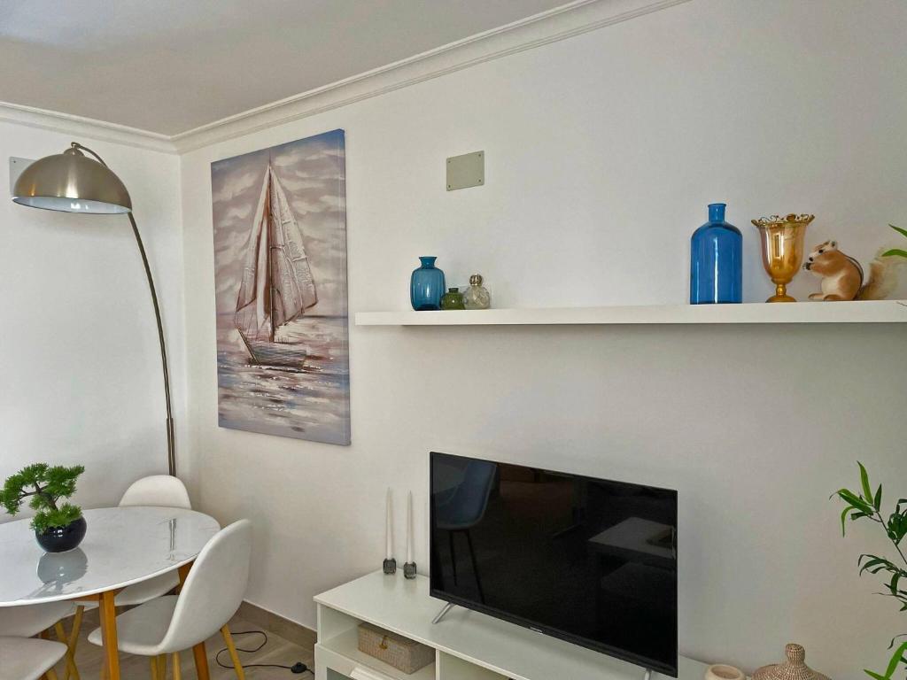 Televízia a/alebo spoločenská miestnosť v ubytovaní Apartamento Alván - Ole Solutions