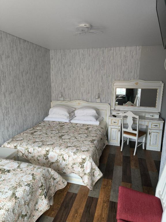 Postel nebo postele na pokoji v ubytování Border studio Grafovi