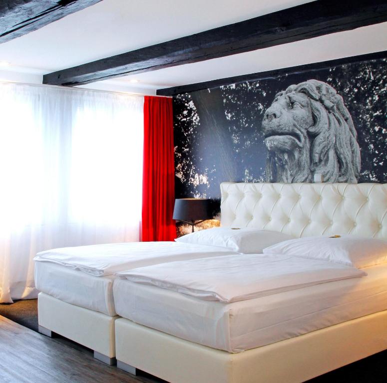 Postel nebo postele na pokoji v ubytování Hotel im Haus zur Hanse