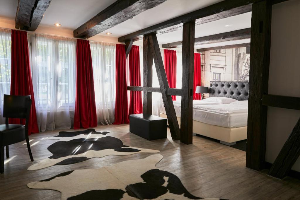 Postel nebo postele na pokoji v ubytování Hotel im Haus zur Hanse